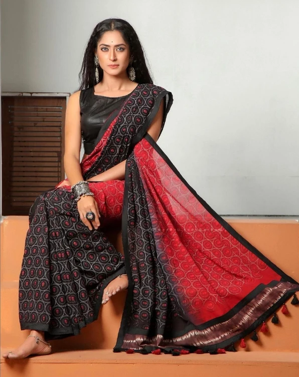 Fashion portrait in a red and black saree